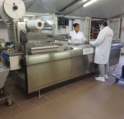 Fabrique where a man and woman are making microdosing mushrooms