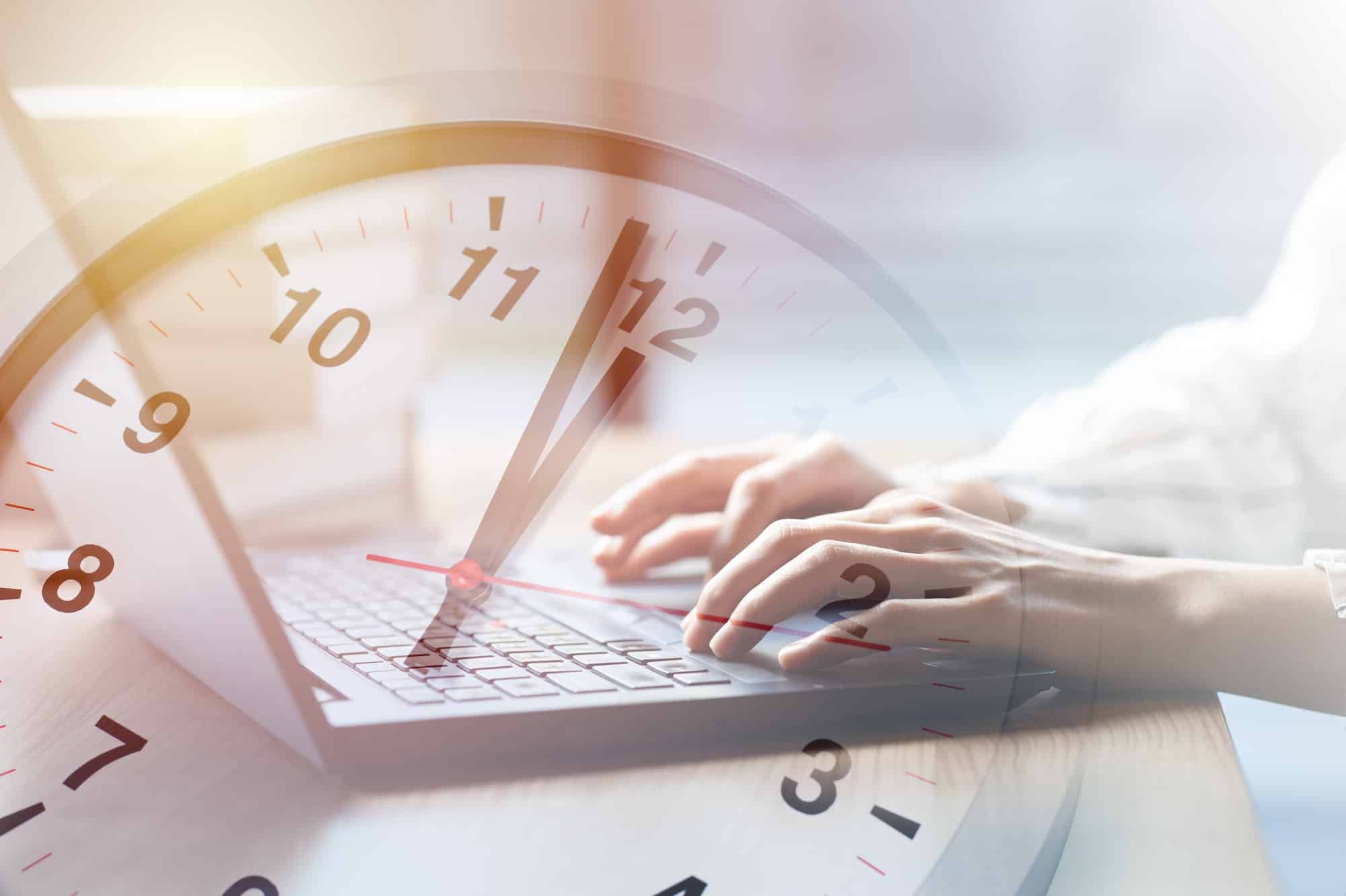 Business working times concept people work typing on laptop computer overlay with in time clock to l